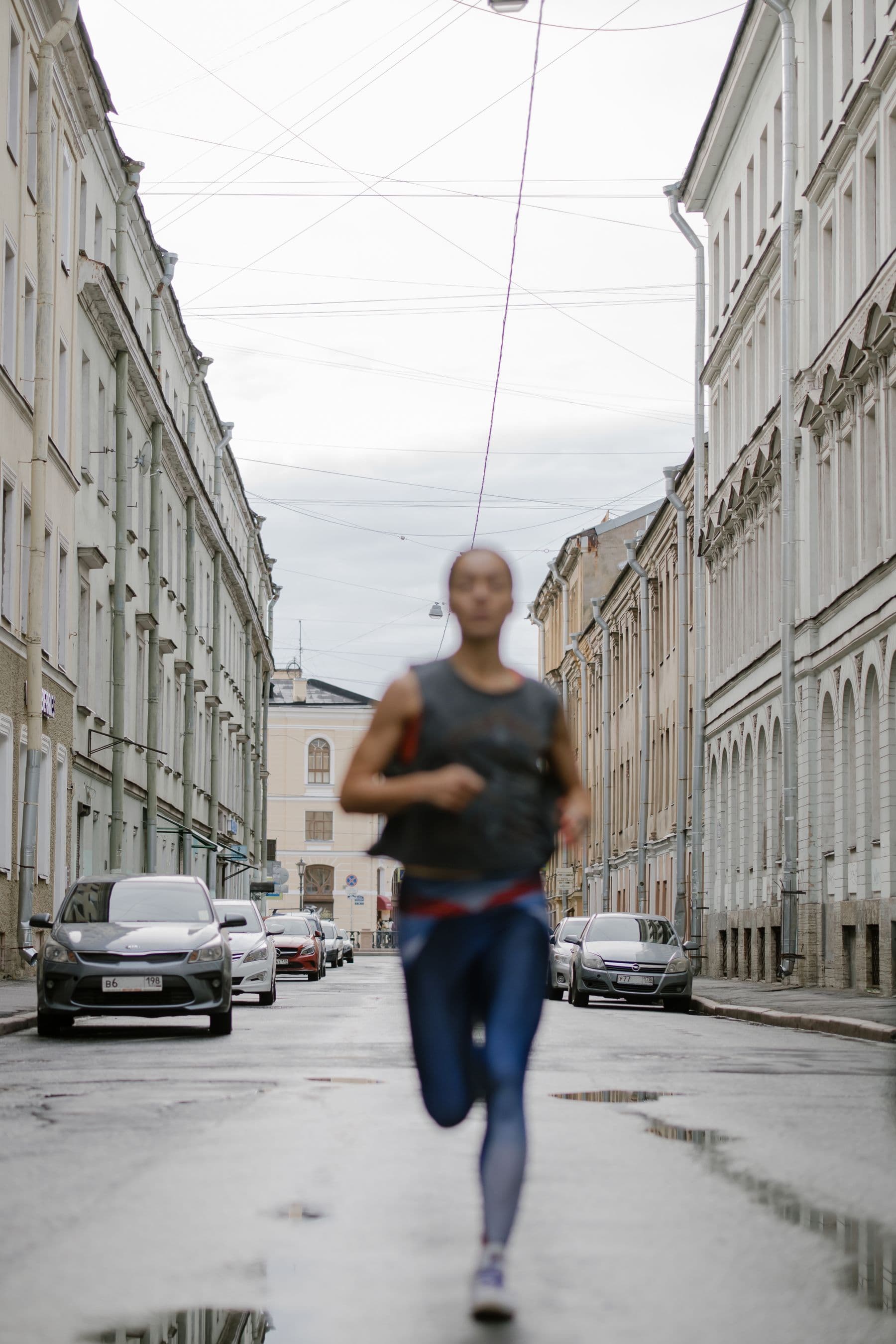 A runner moving through a city street